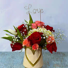Rose arrangement in a heart vase with a rhinestone "Love" topper