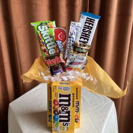 Candy bouquet with assorted chocolate bars and M&M's boxes
