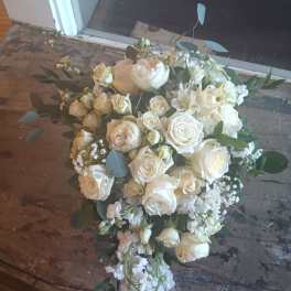White rose bouquet with eucalyptus and small white filler flowers
