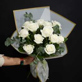 Bouquet of white roses with eucalyptus in white wrap
