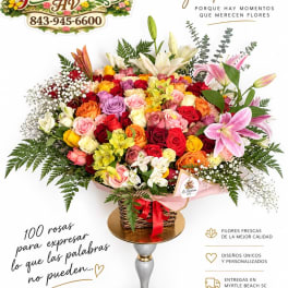 Large mixed rose bouquet with lilies in a basket on a pedestal stand