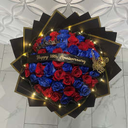 Red and blue rose bouquet with a "Happy 18th Anniversary" ribbon