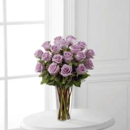 Lavender rose bouquet in a clear glass vase