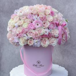Large pink and white rose bouquet in a pink hat box