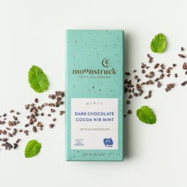 Mint chocolate bar with cocoa nibs and mint leaves
