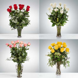 Four rose arrangements in clear glass vases, with red, white, pink, and yellow blooms.