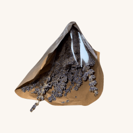 Dried blue-purple flowers wrapped in brown paper and clear plastic