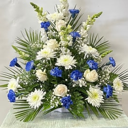 White and blue floral arrangement with roses and chrysanthemums