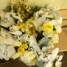 Bouquet of white orchids and yellow roses
