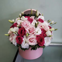 Pink and white rose bouquet in a round pink box