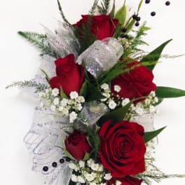 Bouquet of red roses with white filler flowers and silver ribbon