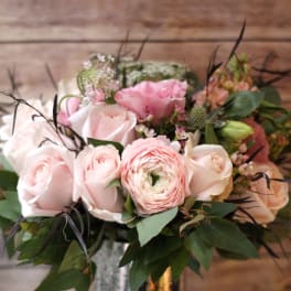 Pink and white flower bouquet in a metallic vase
