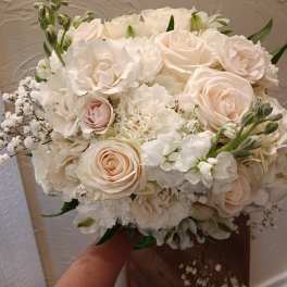 Cream rose and white hydrangea bouquet with baby's breath