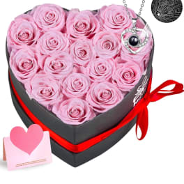 Heart-shaped box of pink roses with a necklace and card