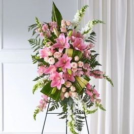 Tall pink and white floral standing spray on an easel