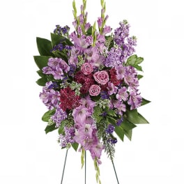 Lavender and pink floral standing spray with roses and orchids