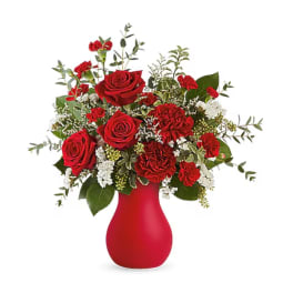 Red roses and carnations in a red vase