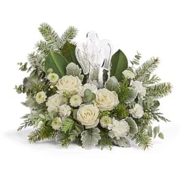 White rose bouquet with evergreen accents and a clear angel topper