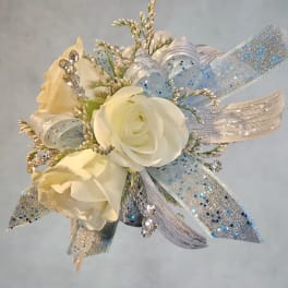 Small white rose corsage with silver and blue ribbon accents