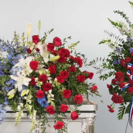 Salute to service casket and standing spray