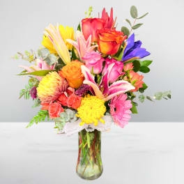 Colorful mixed bouquet in a clear glass vase