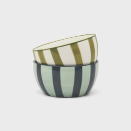 Two striped ceramic bowls stacked together on a white background