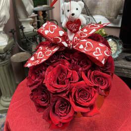 Red rose bouquet with a teddy bear and heart balloon
