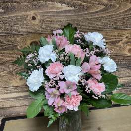 Pink and white bouquet in a glass vase
