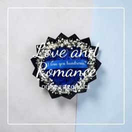 Blue rose bouquet with baby's breath and a ribbon