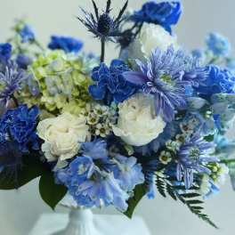 Blue and white bouquet with roses and mixed blooms