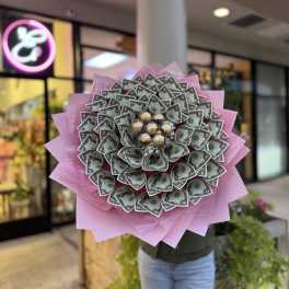 Money bouquet wrapped in pink paper with Ferrero Rocher chocolates