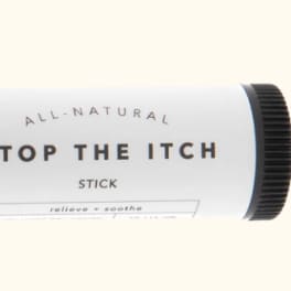 A white and black stick labeled "Stop the Itch"
