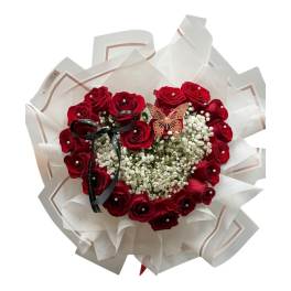 Heart-shaped bouquet of red roses with baby's breath and a butterfly accent