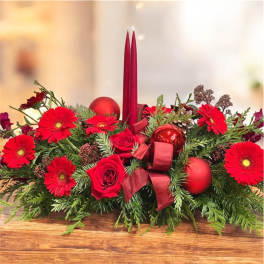 Red floral centerpiece with candles and ornaments