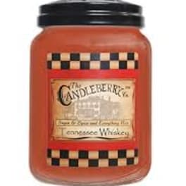 Orange candle jar with a black lid and checkered label