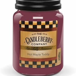 A purple jar candle with a black lid and labeled front