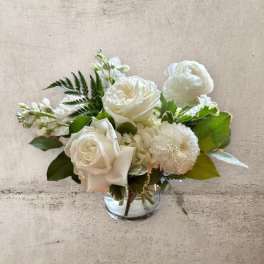 White floral bouquet in a clear glass vase