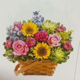 Basket arrangement with pink roses, sunflowers, and mixed blooms