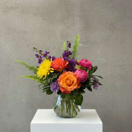 Colorful mixed bouquet in a clear glass vase