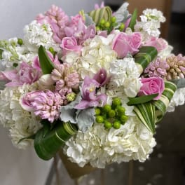 Pink and white bouquet with roses, orchids, and hydrangeas