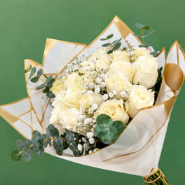 Bouquet of cream roses with baby's breath and eucalyptus in white-and-gold wrap