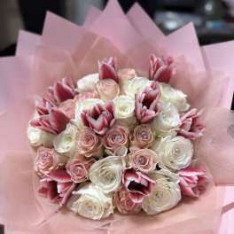 Pink and white rose bouquet with red-and-white tulips wrapped in pink paper