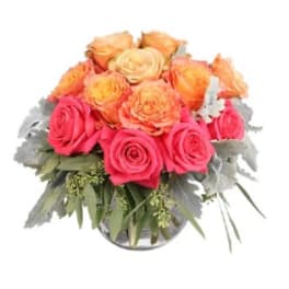 Bouquet of pink and peach roses in a glass vase
