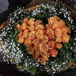 Bouquet of orange roses with white baby's breath