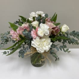 Pink and white mixed bouquet in a glass vase