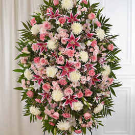 Large standing spray of pink and white flowers with lilies and roses