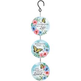 Hanging memorial sign with floral circles and butterfly accents