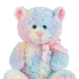Pastel rainbow teddy bear with a pink ribbon