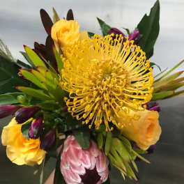Bouquet with yellow pincushion protea and yellow roses