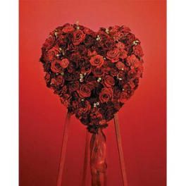Heart-shaped bouquet of red roses with long ribbons